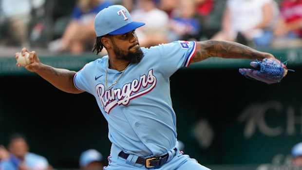 Oct 3, 2021; Arlington, Texas, USA; Texas Rangers relief pitcher Dennis Santana (56) delivers a pitch to the Cleveland Indians during the seventh inning at Globe Life Field. Mandatory Credit: Jim Cowsert-USA TODAY Sports